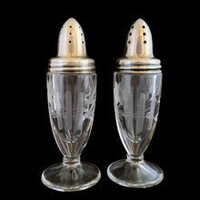 Load image into Gallery viewer, Beautiful pair of antique clear pressed glass salt and pepper shakers featuring a cut pattern of florals and vertical bands topped with silver plated lids. Possibly Fry Glass, Roden Silver for Birks Canada, early 20th century.  In excellent vintage condition, no chips to the glass. Lids are marked, see photo.  Measures 1 5/8 x 4 1/2 inches
