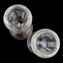 Load image into Gallery viewer, Beautiful pair of antique clear pressed glass salt and pepper shakers featuring a cut pattern of florals and vertical bands topped with silver plated lids. Possibly Fry Glass, Roden Silver for Birks Canada, early 20th century.  In excellent vintage condition, no chips to the glass. Lids are marked, see photo.  Measures 1 5/8 x 4 1/2 inches
