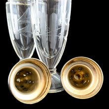 Load image into Gallery viewer, Beautiful pair of antique clear pressed glass salt and pepper shakers featuring a cut pattern of florals and vertical bands topped with silver plated lids. Possibly Fry Glass, Roden Silver for Birks Canada, early 20th century.  In excellent vintage condition, no chips to the glass. Lids are marked, see photo.  Measures 1 5/8 x 4 1/2 inches
