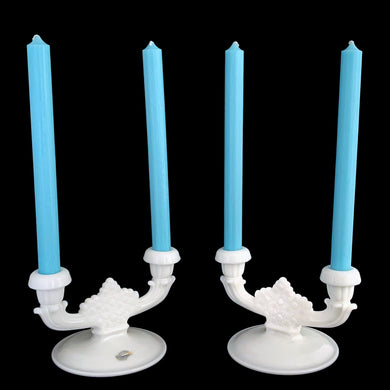 Pair of vintage Daisy and Button double light candlesticks. Crafted by Fenton Art Glass, 1953 - 1974. These elegant candle holders will complement any home decor style, especially cottagecore, farmhouse or shabby chic. They would be perfect for as a wedding gift or used as part of your wedding decor.

In excellent condition, no chips. Remnant of sticker on one candlestick.

Measures 6 7/8 x 5 x 4 3/8 inches