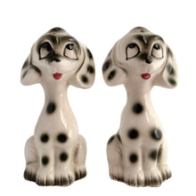 Load image into Gallery viewer, Vintage black and white Dalmatian puppy dog ceramic salt and pepper shakers with plastic stoppers. Japan 1960s. Add these adorable and highly collectible kitschy shakers to your collection!

In excellent vintage condition, no chips/cracks/repairs.

Measures 2 1/8 x 2 x 4 inches

