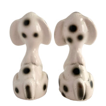 Load image into Gallery viewer, Vintage black and white Dalmatian puppy dog ceramic salt and pepper shakers with plastic stoppers. Japan 1960s. Add these adorable and highly collectible kitschy shakers to your collection!

In excellent vintage condition, no chips/cracks/repairs.

Measures 2 1/8 x 2 x 4 inches
