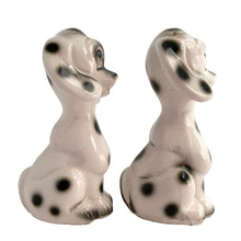 Load image into Gallery viewer, Vintage black and white Dalmatian puppy dog ceramic salt and pepper shakers with plastic stoppers. Japan 1960s. Add these adorable and highly collectible kitschy shakers to your collection!

In excellent vintage condition, no chips/cracks/repairs.

Measures 2 1/8 x 2 x 4 inches
