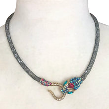 Load image into Gallery viewer, Make a bold statement with this iconic Betsey Johnson necklace from the coveted Dark Shadows collection. Featuring a dramatic pavé crystal snake head and tail, this choker-style necklace coils with edgy glamour and gothic elegance.  Perfect for lovers of designer jewelry, statement chokers, and Betsey Johnson’s signature dark, whimsical aesthetic. Whether styled with evening wear or layered into a modern edgy outfit, this necklace is a true collectible showstopper.

In excellent condition. Signed BJ
