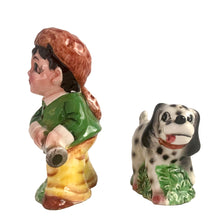 Load image into Gallery viewer, Rare, adorable hand painted young Davey Crockett with Dalmatian hunting dog salt and pepper shakers. Crafted in Japan, 1950s. A sweet kitschy shaker set for your Crockett or shaker collection!

In excellent vintage condition, no chips, with corks.

Davey measures 2 1/4 x 1 3/4 x 3 5/8 inches tall

Dog measures 3 3/8 x 1 /4 x 2 inches
