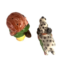 Load image into Gallery viewer, Rare, adorable hand painted young Davey Crockett with Dalmatian hunting dog salt and pepper shakers. Crafted in Japan, 1950s. A sweet kitschy shaker set for your Crockett or shaker collection!

In excellent vintage condition, no chips, with corks.

Davey measures 2 1/4 x 1 3/4 x 3 5/8 inches tall

Dog measures 3 3/8 x 1 /4 x 2 inches
