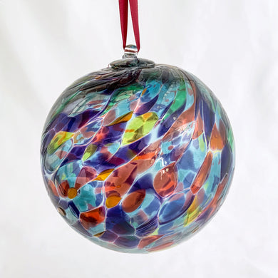 Enjoy the unique beauty of this vintage hand blown glass ball suncatcher with its exotic mix of blues, purples, greens and reds! Hang it up in your window and see the sun transform it into a dazzling display of mesmerizing colours!  In excellent condition.  Measures 4 1/8 inches