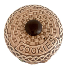 Load image into Gallery viewer, Overhead top-down view of ESD Lefton cookie jar lid — concentric basketweave rings, embossed "COOKIES" banner, dark oval knob finial, white background
