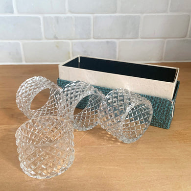 Set of four vintage diamond pattern round glass napkin rings. Crafted in Czechoslovakia, 1960s. Add sparkle to your tablescape with these classic napkin rings.

In excellent condition, no chips. In original box.

Measures 2 x 1 1/4 inches
