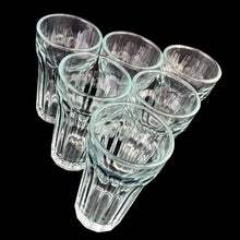 Load image into Gallery viewer, Angled view of six clear paneled juice glasses
