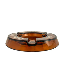 Load image into Gallery viewer, Vintage promotional advertising Dominion White Label Ale amber round glass ashtray. A great piece for the tobacciana and barware collector.  In vintage condition, minor flea bites to the interior rim and wear to the printing.  Measures 6 1/4 x 7/8 inches
