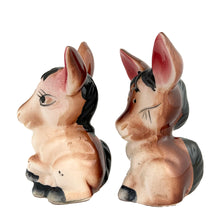 Load image into Gallery viewer, Vintage donkey ceramic salt and pepper shakers with stoppers. Japan, 1960s. Add these adorable kitschy shakers&nbsp;to your collection!

In excellent condition, no chips/cracks/repairs.

Measures 2 5/8 x 2 1/4 x 4 1/8 inches
