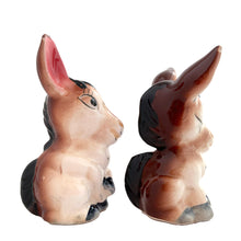 Load image into Gallery viewer, Vintage donkey ceramic salt and pepper shakers with stoppers. Japan, 1960s. Add these adorable kitschy shakers&nbsp;to your collection!

In excellent condition, no chips/cracks/repairs.

Measures 2 5/8 x 2 1/4 x 4 1/8 inches
