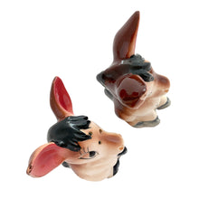 Load image into Gallery viewer, Vintage donkey ceramic salt and pepper shakers with stoppers. Japan, 1960s. Add these adorable kitschy shakers&nbsp;to your collection!

In excellent condition, no chips/cracks/repairs.

Measures 2 5/8 x 2 1/4 x 4 1/8 inches
