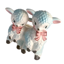 Load image into Gallery viewer, Adorable and rare, anthropomorphic hand painted pale blue double lamb planter with each lamb wearing a pink bow. Crafted by ARCO, Japan, 1950s. A sweet kitschy addition for your new addition. Use for tiny plants or repurpose to hold baby accessories.

In excellent as found vintage condition, no chips/cracks/repairs, normal crazing present.

Measures 5 1/2 x 4 3/4 x 6 inches
