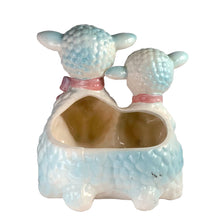 Load image into Gallery viewer, Adorable and rare, anthropomorphic hand painted pale blue double lamb planter with each lamb wearing a pink bow. Crafted by ARCO, Japan, 1950s. A sweet kitschy addition for your new addition. Use for tiny plants or repurpose to hold baby accessories.

In excellent as found vintage condition, no chips/cracks/repairs, normal crazing present.

Measures 5 1/2 x 4 3/4 x 6 inches
