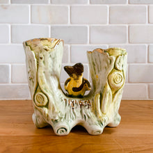 Load image into Gallery viewer, Once can&#39;t help but smile at this adorable pale green double tree trunk vase with sweet yellow bird perched in the middle and gold gilt details. This vessel is perfect for creating a small floral bouquet or simply display it amongst your treasures. Produced by Ucagco, Japan, circa 1950s.  In excellent condition, free from chips/cracks/repairs. Marked Japan on the bottom.  Measures 5 1/8 x 3 x 4 1/4 inches
