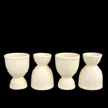 Load image into Gallery viewer, Four Hankscraft double-sided ribbed ceramic egg cups, off-white glaze with banded rims, USA 1940s
