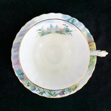 Load image into Gallery viewer, This vintage bone china footed teacup and saucer is so sweet! Both the cup and saucer are decorate with the &quot;Dovedale&quot; pattern from the Country Scenes series. Each piece has a lovely scalloped edge with hand painted whimsical country scene, trimmed with gold gilt. Produced by Royal Albert, England, circa 1917 - 1927.  In excellent condition, free from chips, cracks and repairs. Maker&#39;s marks are on the bottom.   Teacup measures 3 3/8 x 2 3/4 inches  | Saucer measures 5 1/2 inches
