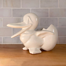 Load image into Gallery viewer, Vintage gloss white Duck and Egg planter. Crafted by McCoy Pottery, 1950s. This rare planter must for any art pottery collector!

In used vintage condition, no chips/repairs, tight hairline at the back of the egg, cold paint has rubbed off. McCoy mark on the bottom.

Measures 7 x 3 1/4 x 5 1/4 inches
