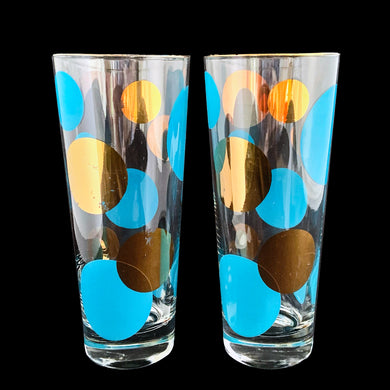 Pair of vintage mid century era Eclipse cooler glasses featuring blue and 22 karat gold dots in varying size with gold rims. Designed by Russel Wright for Bartlett Collins, USA, 1958. These hard-to-find glasses are spectacular and these highly sought after glasses are on every MCM collector's must have list. They are sure to be the stars of your bar cart...cheers!

In great vintage condition, no chips, very minor age related wear to the gold.

Measures 2 7/8 x 6 7/8 inches

Capacity 14 ounces