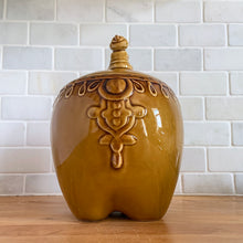 Load image into Gallery viewer, vintage cookie jar of figural elephant features a turbin wearing gentleman sitting on a pillow riding on top which forms the lid&#39;s finial. adorable and the expression on the rider&#39;s face is sassy! The elephant is beautifully decorated in an East Indian motif. Crafted by Noritake, Japan for Giftcraft export. In outstanding condition, free from chips/cracks/wear. We believe this is new old stock. Original sticker present and the bottom has the stamped maker&#39;s mark. Measures 7 1/2 x 5 1/2 x 9 3/4 inches
