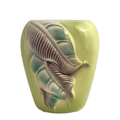 Vintage mid-century ovoid shaped vase with embossed leaves on a chartreuse ground. Crafted by Royal Copley, USA, circa 1950s. Perfect for a sweet bouquet or decor.

In as found vintage condition, chip to one of the leaves, no cracks/repairs. Unmarked

Measures 4 1/4 x 3 x 5 1/4 inches
