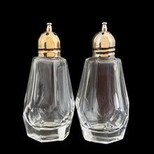 Load image into Gallery viewer, Enhance your tablescape with these sparkling vintage faceted cut crystal salt and peppers shakers topped with silver plated lids....stunning! The crystal is in excellent condition, free from chips. Original &quot;Made in Japan&quot; stickers. Measures 1 1/4 x 2 7/8 inches
