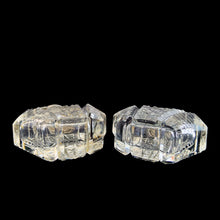 Load image into Gallery viewer, Enhance your tablescape with sparkling vintage brilliant fine cut crystal fan-shaped salt and peppers shakers topped with sterling silver lids inlaid with mother-of-pearl....stunning!

The crystal is in excellent condition, no chips. The sterling silver lids show age related wear. Marked Sterling 925 with hallmark.

Measures 2 x 4 1/2 inches
