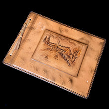 Load image into Gallery viewer, Beautiful vintage mid-century era leather bound photo album featuring a tooled farmstead scene and stitched edge, contains 25 black pages separated with thin onion paper. Create your own book of precious memories with this charming album.

In good unused vintage condition with minor spots of wear to the cover.

Measures 13 3/4 x 10 inches
