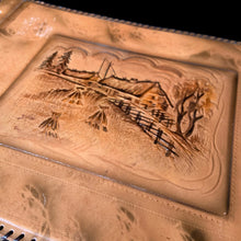 Load image into Gallery viewer, Beautiful vintage mid-century era leather bound photo album featuring a tooled farmstead scene and stitched edge, contains 25 black pages separated with thin onion paper. Create your own book of precious memories with this charming album.

In good unused vintage condition with minor spots of wear to the cover.

Measures 13 3/4 x 10 inches
