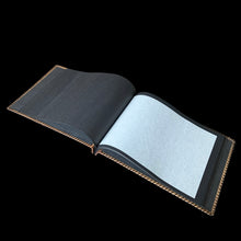 Load image into Gallery viewer, Beautiful vintage mid-century era leather bound photo album featuring a tooled farmstead scene and stitched edge, contains 25 black pages separated with thin onion paper. Create your own book of precious memories with this charming album.

In good unused vintage condition with minor spots of wear to the cover.

Measures 13 3/4 x 10 inches
