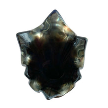 Load image into Gallery viewer, Top-down view into the open ruffled rim of a Fenton Fine Rib cobalt blue carnival glass swung vase, showing deep dark interior with iridescent teal and bronze reflections on the scalloped edge
