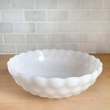 Load image into Gallery viewer, Oh so cottagey, vintage Fire-King Bubble milk glass round vegetable bowl featuring a bubble exterior and starburst bottom. Crafted by Anchor Hocking, USA, 1934 - 1965. Perfect for serving your favourite dish!

In excellent condition, no chips or cracks.

Measures 8 1/4 x 2 5/8 inches
