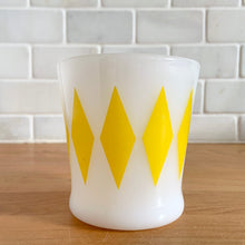 Load image into Gallery viewer, Highly collectible vintage Fire-King Ware milk glass mug with turquoise diamonds, D-handle. Crafted by Anchor Hocking, USA, 1960s. A must-have for any Fire-King collector!

In excellent condition, no chips, cracks or repairs. Paint is vibrant and shiny.

Measures 3 1/4 x 3 3/8 inches

