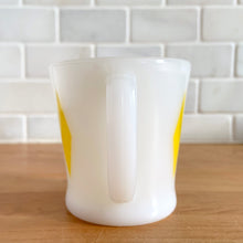 Load image into Gallery viewer, Highly collectible vintage Fire-King Ware milk glass mug with turquoise diamonds, D-handle. Crafted by Anchor Hocking, USA, 1960s. A must-have for any Fire-King collector!

In excellent condition, no chips, cracks or repairs. Paint is vibrant and shiny.

Measures 3 1/4 x 3 3/8 inches
