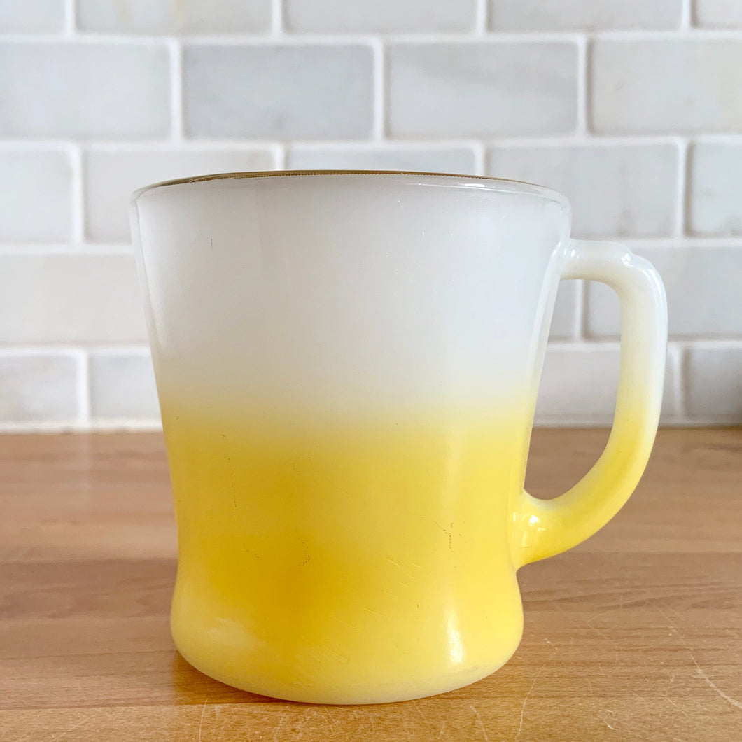 Highly collectible vintage Fire-King Ware milk glass mug with yellow fade and gold rim, D-handle. Crafted by Anchor Hocking, USA, 1960s. A must-have for any Fire-King collector!

In excellent condition, no chips, cracks or repairs. Paint is vibrant and shiny.

Measures 3 1/4 x 3 3/8 inches