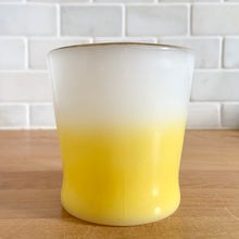 Load image into Gallery viewer, Highly collectible vintage Fire-King Ware milk glass mug with yellow fade and gold rim, D-handle. Crafted by Anchor Hocking, USA, 1960s. A must-have for any Fire-King collector!

In excellent condition, no chips, cracks or repairs. Paint is vibrant and shiny.

Measures 3 1/4 x 3 3/8 inches
