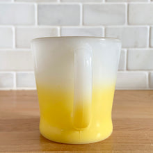 Load image into Gallery viewer, Highly collectible vintage Fire-King Ware milk glass mug with yellow fade and gold rim, D-handle. Crafted by Anchor Hocking, USA, 1960s. A must-have for any Fire-King collector!

In excellent condition, no chips, cracks or repairs. Paint is vibrant and shiny.

Measures 3 1/4 x 3 3/8 inches
