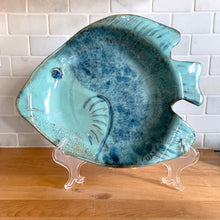 Load image into Gallery viewer, This one-of-a-kind studio art pottery figural fish dish is an exquisite example of artisan craftsmanship. Glazed in an aqua and blue with a textured surface, it&#39;s a stunning piece that will bring a splash of beauty to your home. Signed by the artist with the initials &quot;JF,&quot; it&#39;s perfect for showing off candies and other treats or just adding a touch of beauty to your decor.  In excellent condition, free from chips/cracks/repairs.  Measures approximately 13 3/4 x 11 x1 3/4 inches
