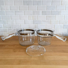 Load image into Gallery viewer, Vintage Flameware clear glass double boiler no. 6283-U1 1/2 QT with glass lid 6283-C C-18. Crafted by PYREX, USA, between 1936 - 1979. The absolute best way to melt chocolate, make creamy smooth hollandaise sauce or prepare custards!

In excellent condition, no chips. Maker&#39;s mark on each piece.

Measures 12 x 6 1/2 x 7 1/2 inches (incl. handle)
