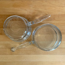 Load image into Gallery viewer, Vintage Flameware clear glass double boiler no. 6283-U1 1/2 QT with glass lid 6283-C C-18. Crafted by PYREX, USA, between 1936 - 1979. The absolute best way to melt chocolate, make creamy smooth hollandaise sauce or prepare custards!

In excellent condition, no chips. Maker&#39;s mark on each piece.

Measures 12 x 6 1/2 x 7 1/2 inches (incl. handle)
