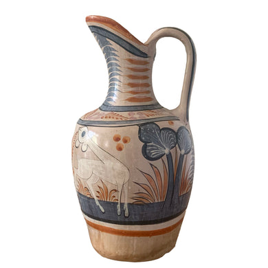 A stunning example of vintage Tonala folk art pottery, this unique hand painted pitcher or jug features whimsical floral and fauna in shades of burnt orange, rose and charcoal gray on a tan ground. Signed MEXICA 1960s era. A beautiful one-of-a-kind piece to enhance your home's decor!


In good vintage condition, no chips/cracks/repairs, age-related wear/patina.

Measures approximately 6 x 6 x 13 3/8 inches