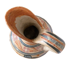 Load image into Gallery viewer, A stunning example of vintage Tonala folk art pottery, this unique hand painted pitcher or jug features whimsical floral and fauna in shades of burnt orange, rose and charcoal gray on a tan ground. Signed MEXICA 1960s era. A beautiful one-of-a-kind piece to enhance your home&#39;s decor!


In good vintage condition, no chips/cracks/repairs, age-related wear/patina.

Measures approximately 6 x 6 x 13 3/8 inches
