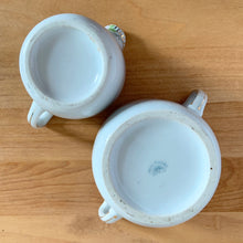 Load image into Gallery viewer, Underside of vintage Nippon porcelain creamer and sugar bowl showing unglazed foot rims and Morimura Brothers maker's mark
