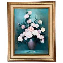 Load image into Gallery viewer, Bring a touch of vintage charm to your home with this stunning oil painting. The delicate floral still life is filled with beautiful pastel colors of pink and yellow roses, set against a bold teal background. Signed by the artist. Perfect for adding a pop of color and drama to any space.  The canvas is in excellent condition. The gold gilt wood frame has some minor damage.  Canvas measures 18 x 24 inches  Frame measures 24 3/8 x 30 1/2 inches
