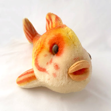 Vintage Flossy gold koi fish stuffed animal features bright red, orange and yellow, mohair mohair plush material with large amber glass eyes with black pupils, and a peach felt mouth. Original round red, blue and yellow tag bearing the name 