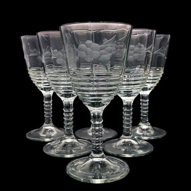 Set of six vintage series 145 water goblet wine glasses, featuring a beautifully cut a floral pattern on the top half of the bowl with the lower half ribbed as well as the stem. Crafted by Federal Glass, USA, 1936 - 1939. A gorgeous addition to your barware!

In excellent condition, no chips.

Measures 3 3/8 x 6 5/8 inches

Capacity 8 ounces