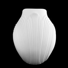 Load image into Gallery viewer, Vintage white bisque flower vase, 0327, featuring an embossed Art Nouveau flower and leaf plume with smooth rim. Designed by M. Frey for Kaiser, Germany, 1980s. This delicate ovoid shaped vase will look stunning in any setting!

In excellent condition, no chips/cracks/repairs. Maker&#39;s mark on bottom.

Measures 8 1/4 x 7 x 8 7/8 inches
