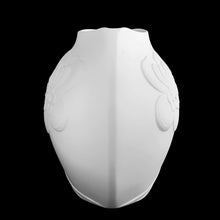 Load image into Gallery viewer, Vintage white bisque flower vase, 0327, featuring an embossed Art Nouveau flower and leaf plume with smooth rim. Designed by M. Frey for Kaiser, Germany, 1980s. This delicate ovoid shaped vase will look stunning in any setting!

In excellent condition, no chips/cracks/repairs. Maker&#39;s mark on bottom.

Measures 8 1/4 x 7 x 8 7/8 inches
